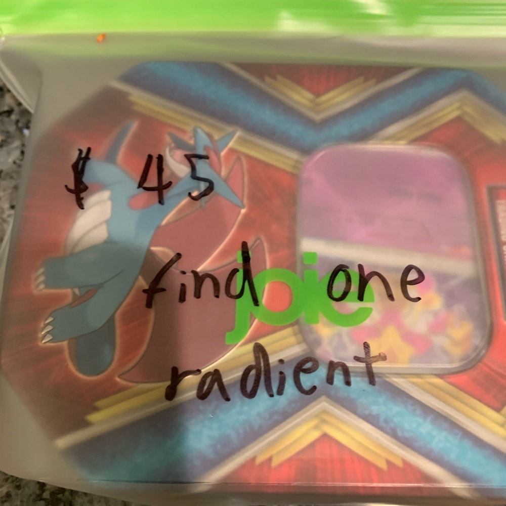 A box with one radiant Pokémon card you get to keep a nice box